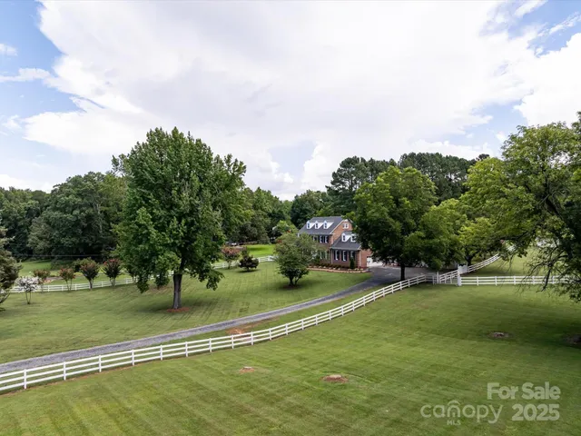 a view of a swimming pool with a yard