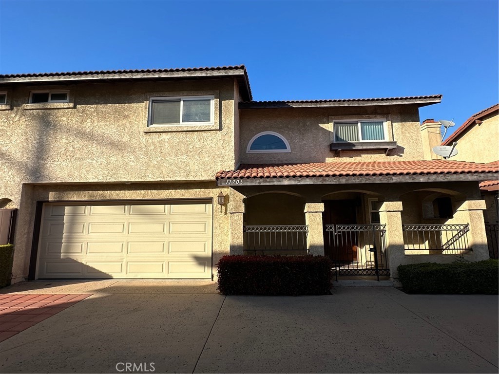 a front view of a house with garage