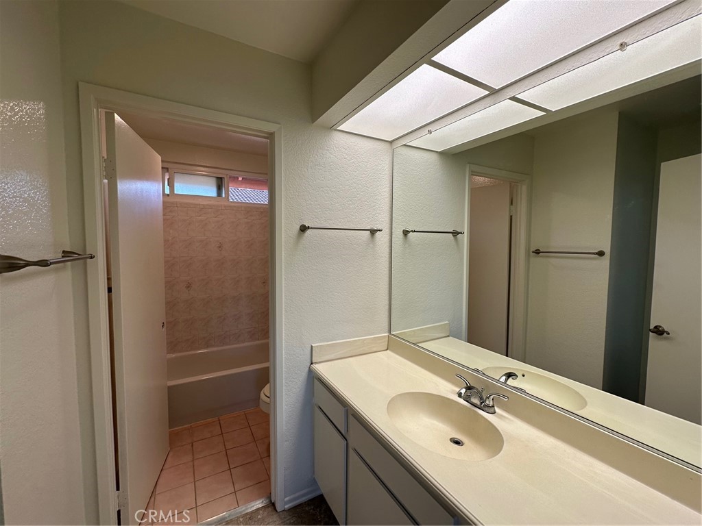 11705 Ramona Boulevard El Monte, CA 91732 - Photo 11 of 15 a bathroom with a sink and mirror