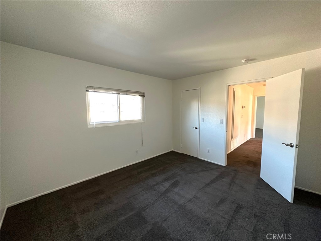 11705 Ramona Boulevard El Monte, CA 91732 - Photo 12 of 15 an empty room with windows