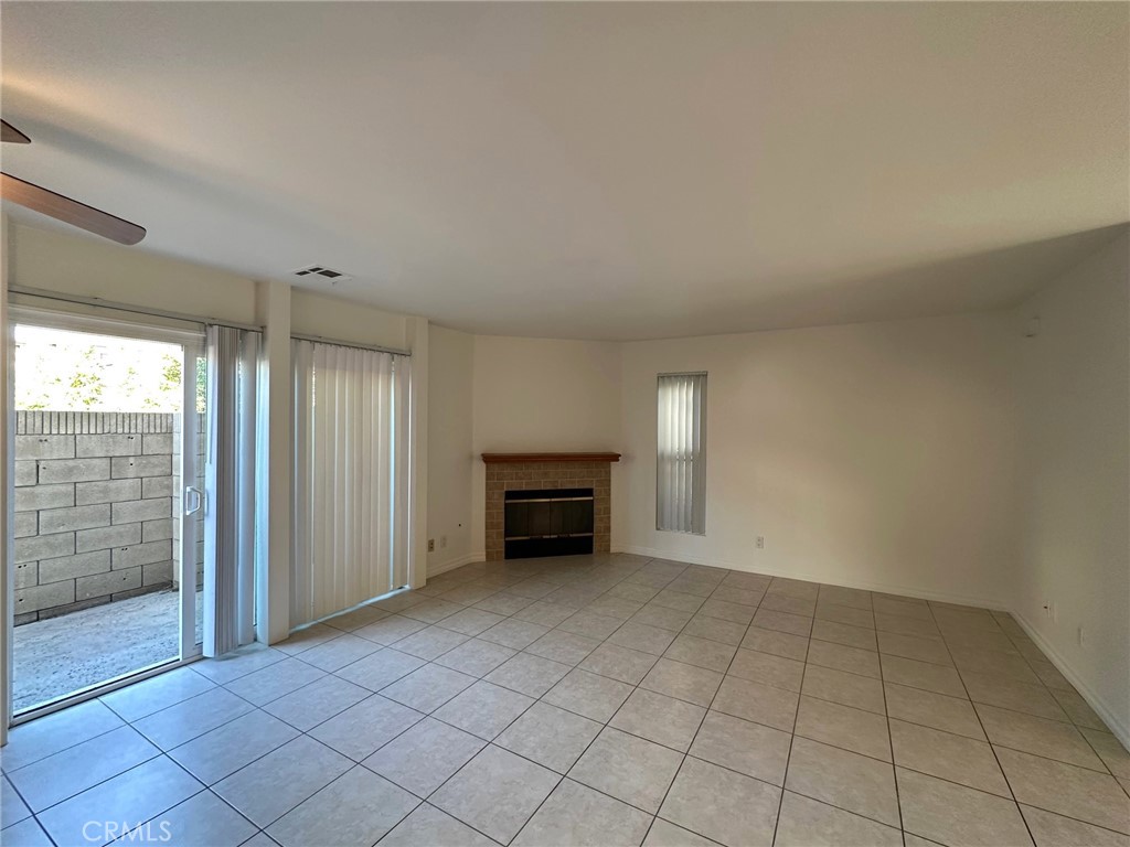 11705 Ramona Boulevard El Monte, CA 91732 - Photo 2 of 15 an empty room with fireplace