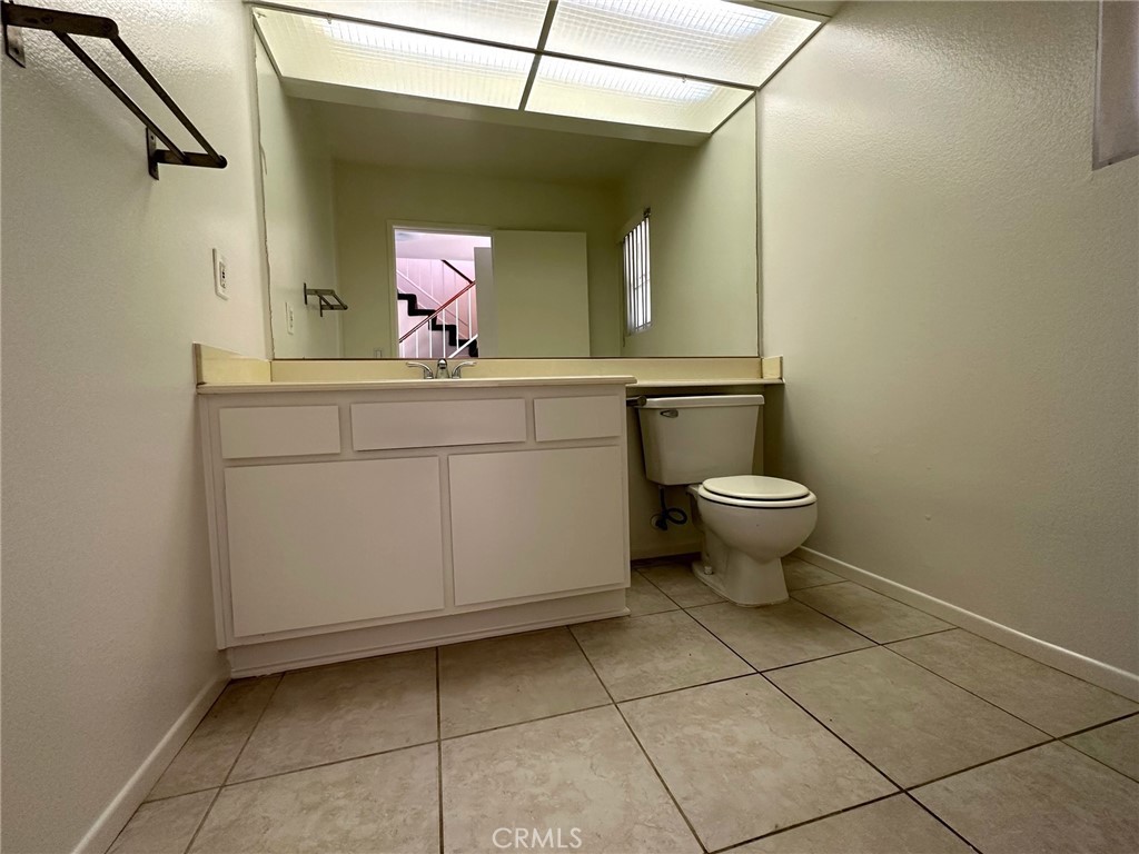 11705 Ramona Boulevard El Monte, CA 91732 - Photo 3 of 15 a bathroom with a sink toilet and mirror