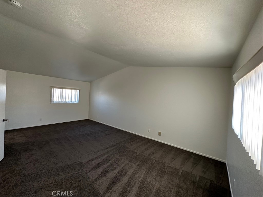 11705 Ramona Boulevard El Monte, CA 91732 - Photo 6 of 15 an empty room with a window