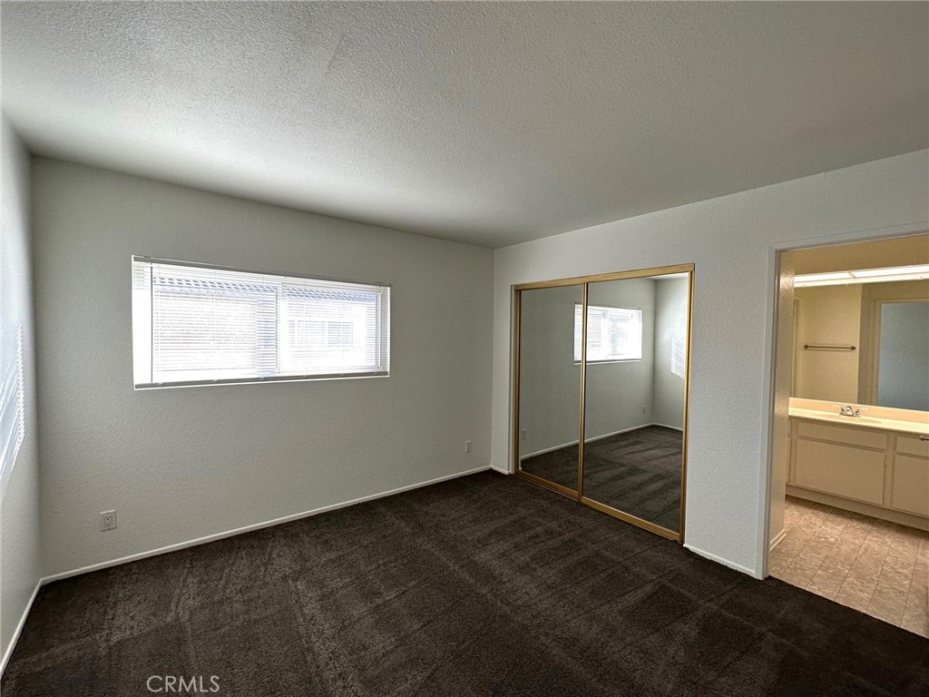 11705 Ramona Boulevard El Monte, CA 91732 - Photo 9 of 15 a view of an empty room with wooden floor and a window