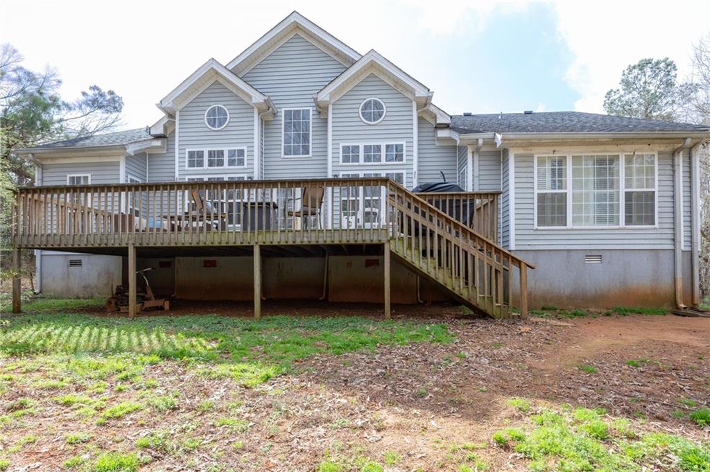 7387 Milam Road Winston, GA 30187 - Photo 37 of 41 a view of a house with a yard and a wooden deck
