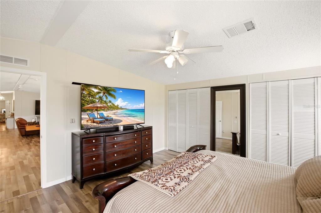 12368 Lexington Place Arcadia, FL 34269 - Photo 12 of 31 a bedroom with a bed and a flat screen tv