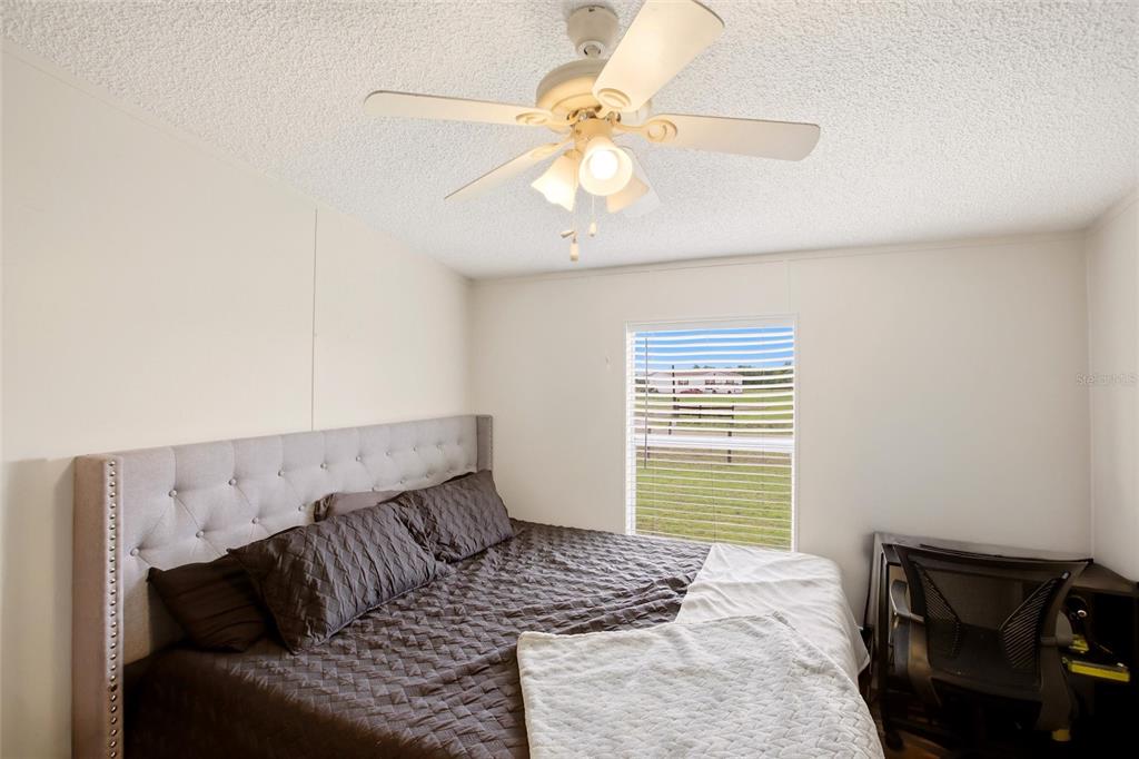 12368 Lexington Place Arcadia, FL 34269 - Photo 16 of 31 a bedroom with a bed and a window