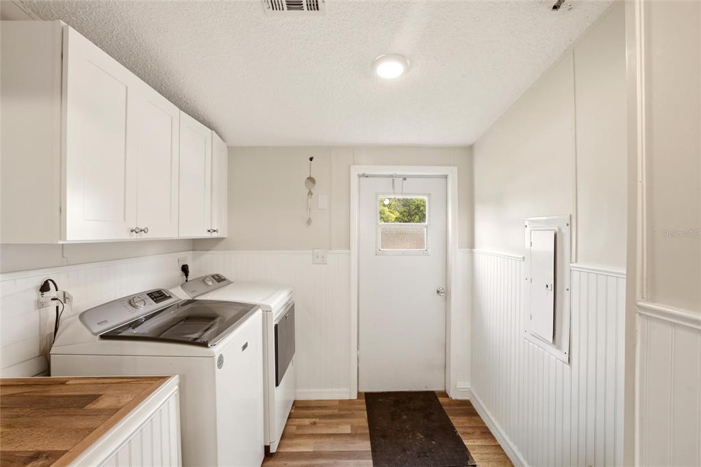 12368 Lexington Place Arcadia, FL 34269 - Photo 22 of 31 a kitchen with a sink a stove and refrigerator