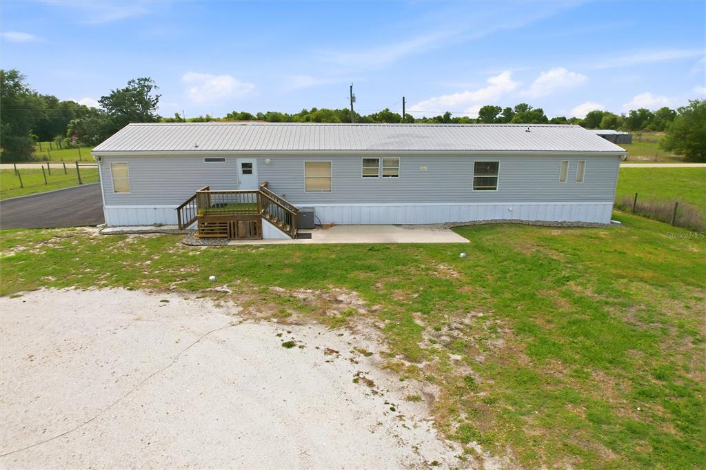 12368 Lexington Place Arcadia, FL 34269 - Photo 23 of 31 a view of a house with a backyard