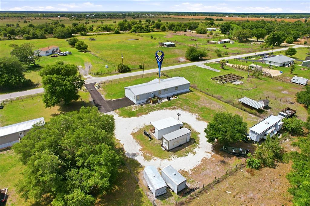 12368 Lexington Place Arcadia, FL 34269 - Photo 25 of 31 an aerial view of a house with a garden view