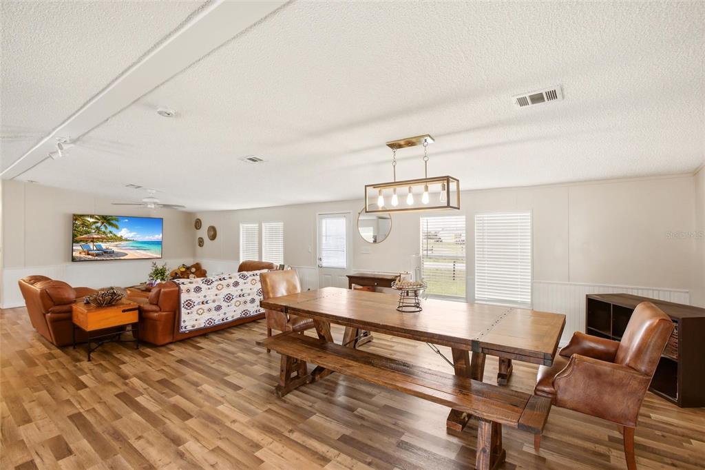 12368 Lexington Place Arcadia, FL 34269 - Photo 4 of 31 a living room with furniture and wooden floor