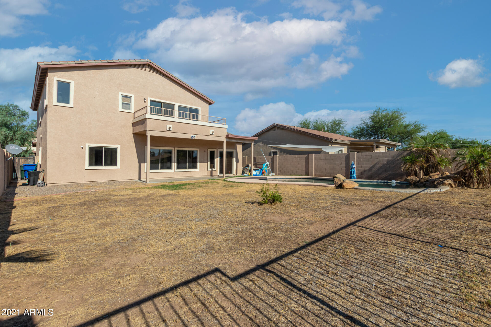 5505 West Pecan Road Laveen, AZ 85339 - Photo 31 of 31 a front view of a house with a yard