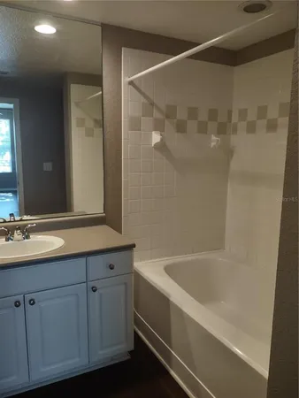 a bathroom with a bathtub and a sink