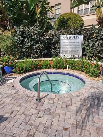 a view of a swimming pool with a bench