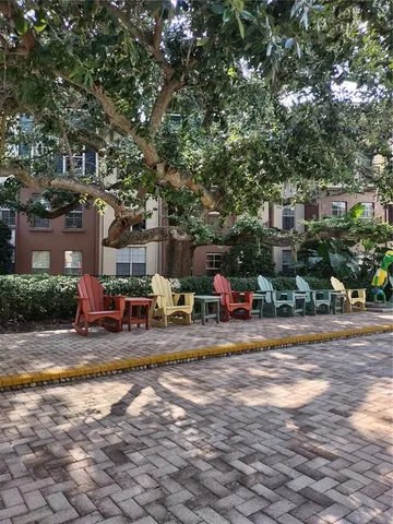 a view of a yard with cars