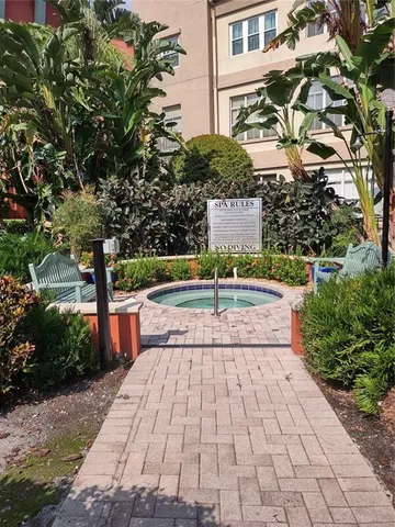 a front view of a building with garden