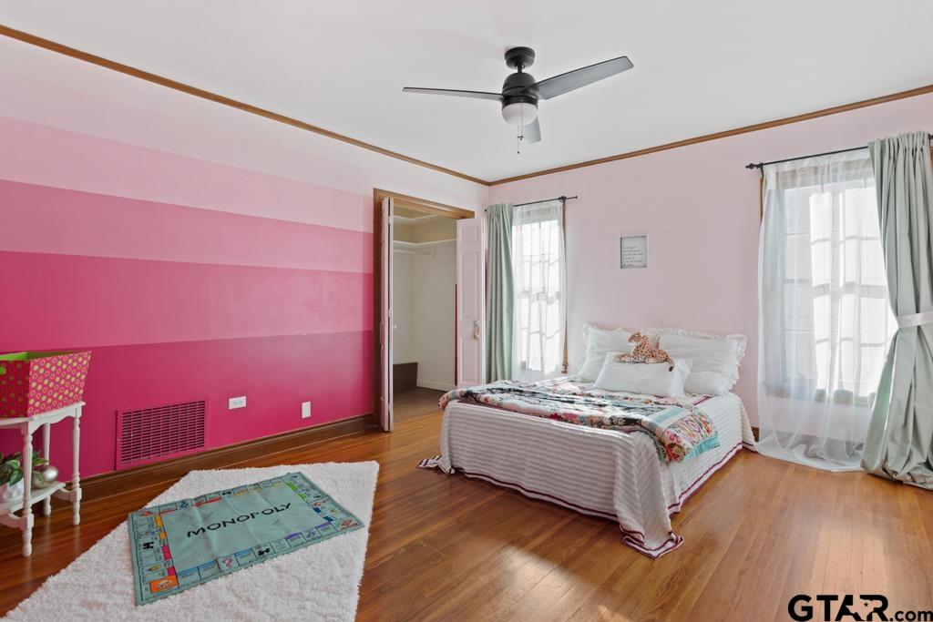 205 North Henry Street Lindale, TX 75771 - Photo 24 of 36 a bedroom with a bed and a window