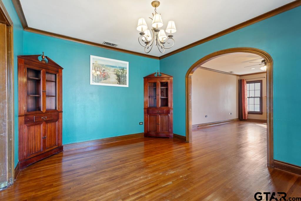 205 North Henry Street Lindale, TX 75771 - Photo 7 of 36 a view of empty room with wooden floor and fan