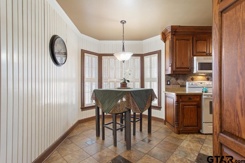 205 North Henry Street Lindale, TX 75771 - Photo 9 of 36 a view of a dining room with furniture window and wooden floor