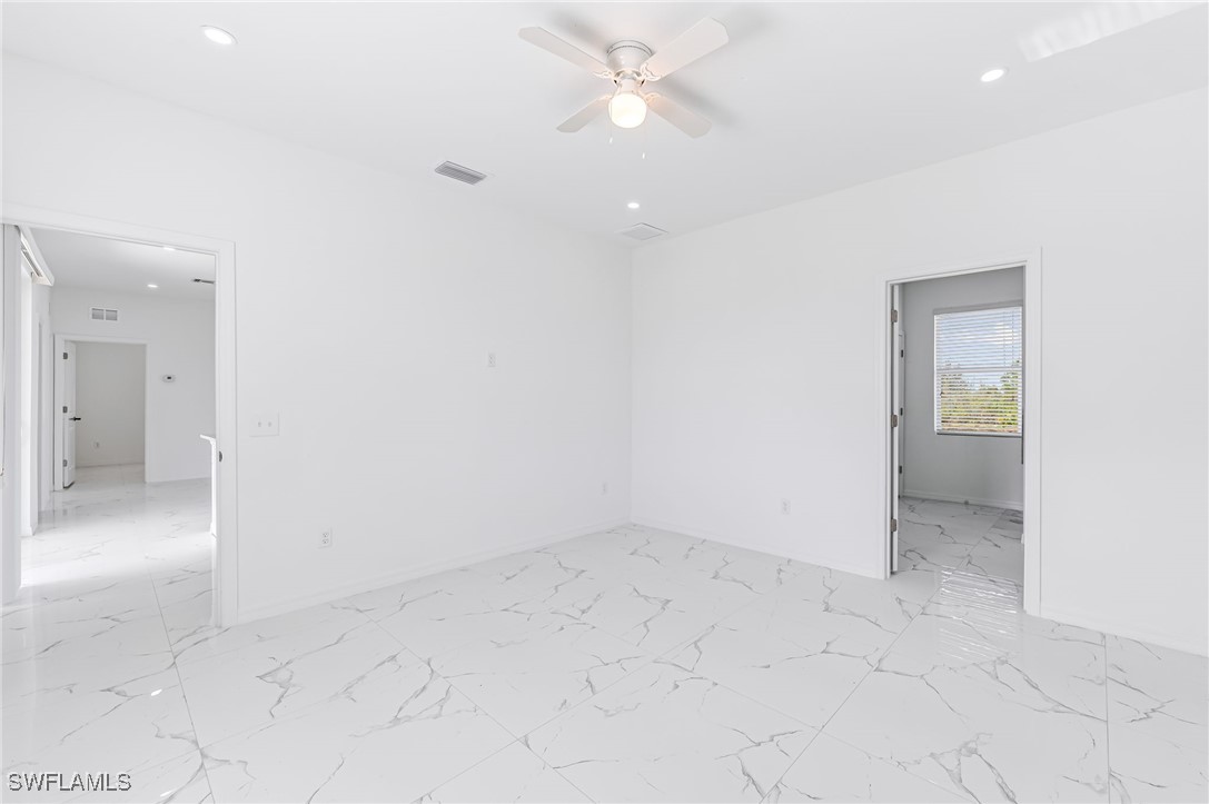 2102 Robert Avenue Alva, FL 33920 - Photo 14 of 24 an empty room with fan and entrance