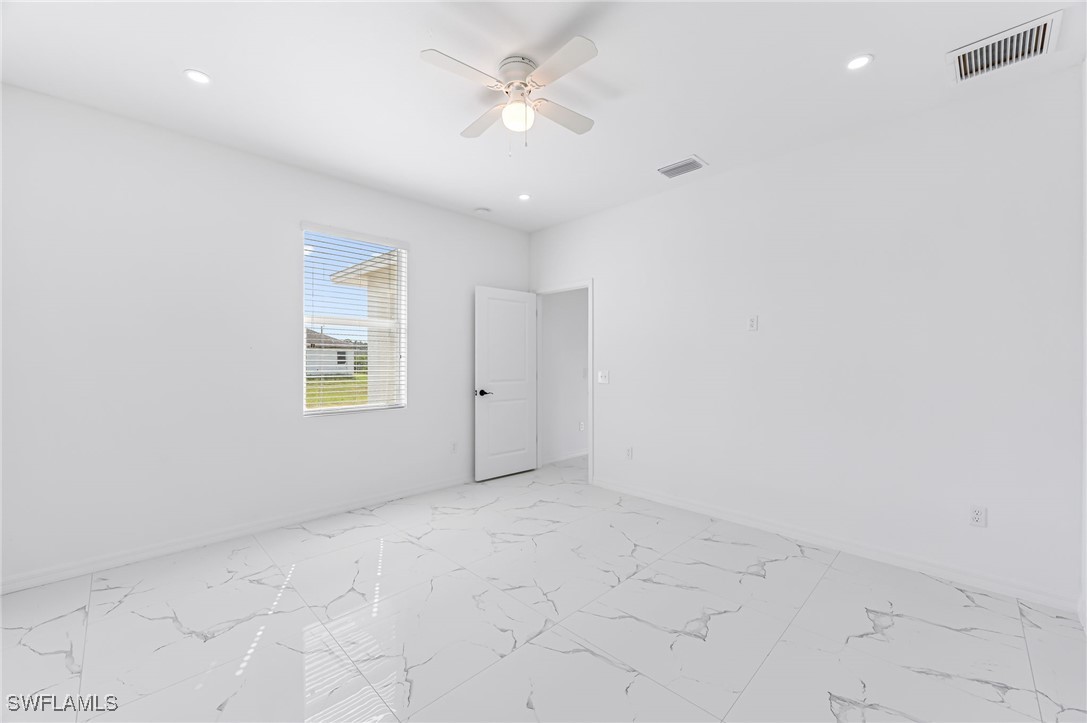 2102 Robert Avenue Alva, FL 33920 - Photo 15 of 24 an empty room with a ceiling fan and a window