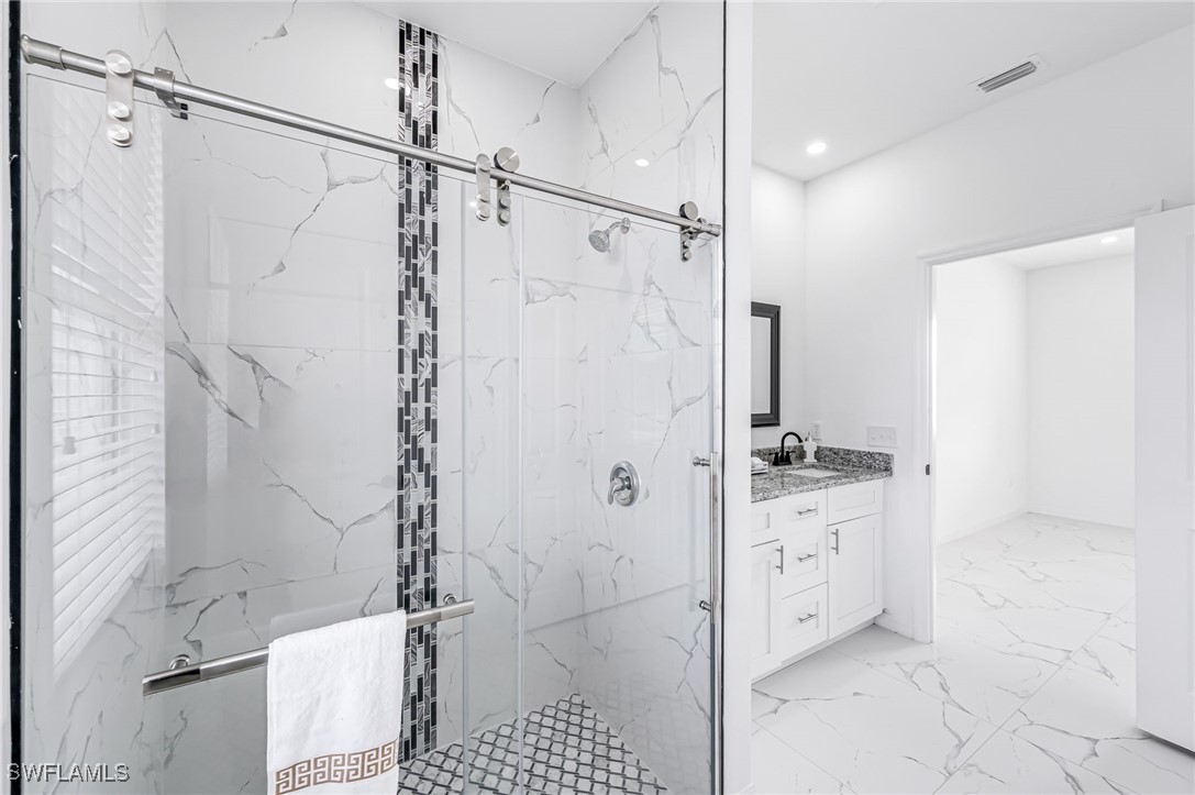 2102 Robert Avenue Alva, FL 33920 - Photo 18 of 24 a bathroom with a granite countertop shower sink and toilet