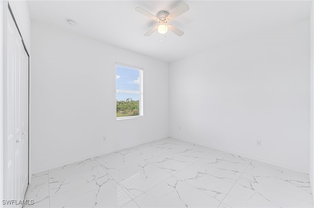 2102 Robert Avenue Alva, FL 33920 - Photo 19 of 24 an empty room with a window and a fan