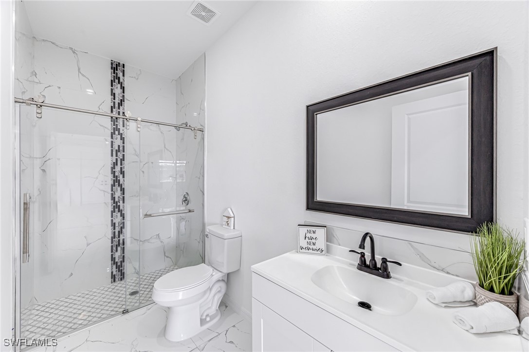 2102 Robert Avenue Alva, FL 33920 - Photo 20 of 24 a bathroom with a sink toilet and shower