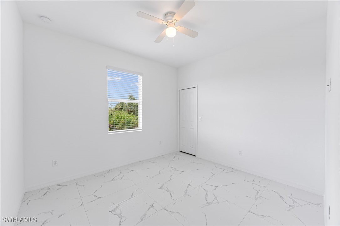 2102 Robert Avenue Alva, FL 33920 - Photo 21 of 24 an empty room with a window and a fan
