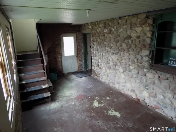 a view of entryway with stairs