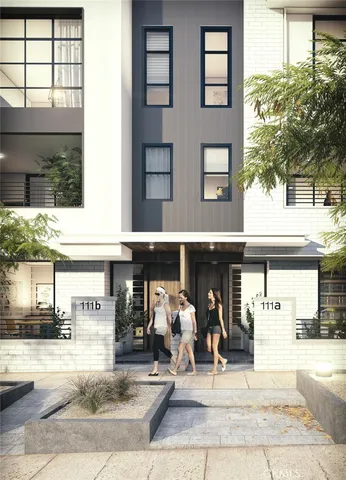 a front view of a residential apartment building with a yard