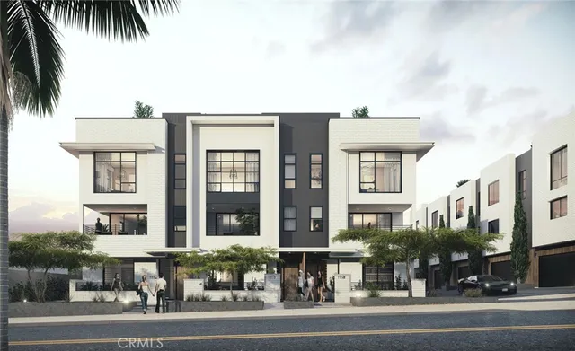 a view of a building and a cars park