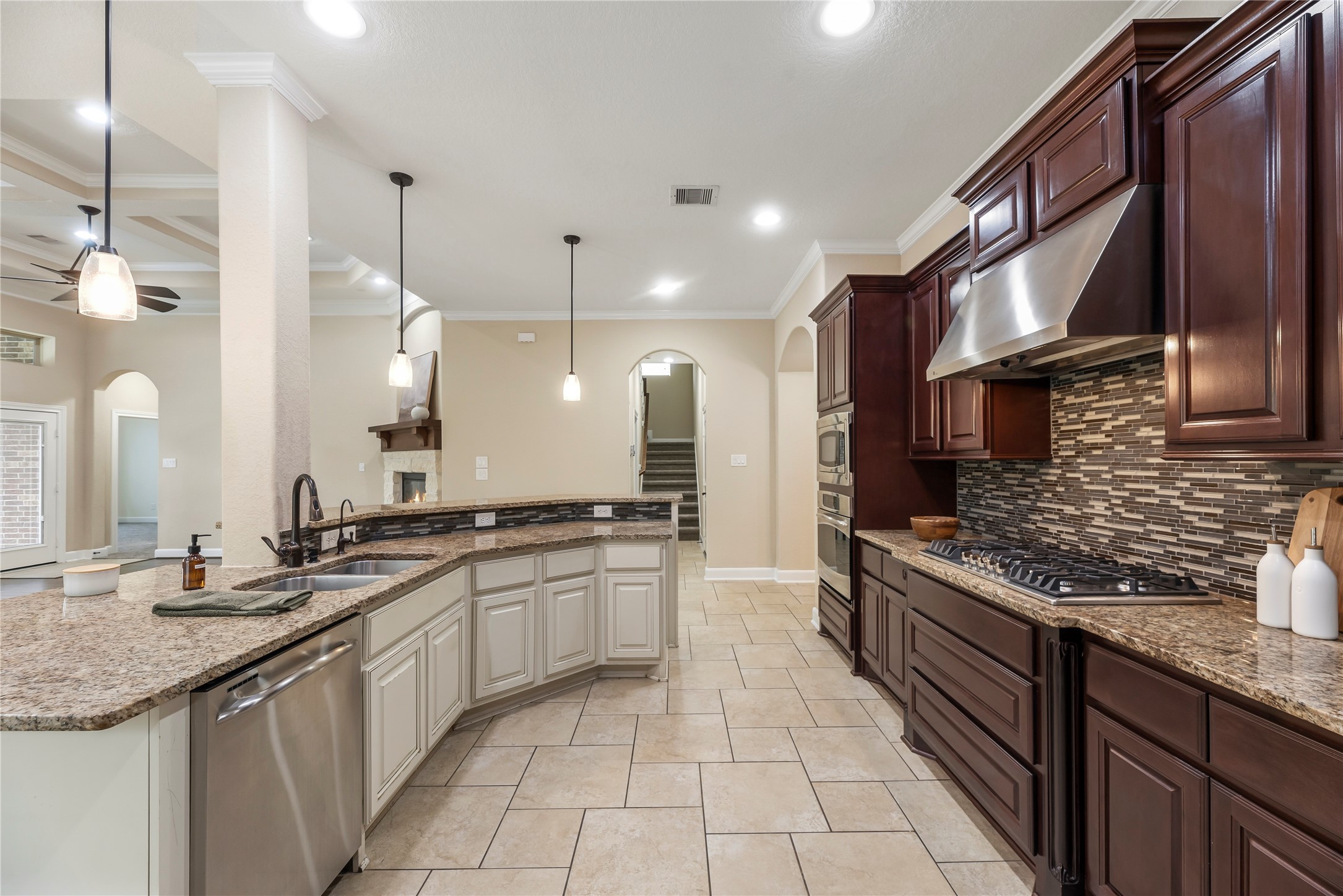 9915 Rochs Hill Court Katy, TX 77494 - Photo 11 of 32 a large kitchen with stainless steel appliances granite countertop a sink and a stove