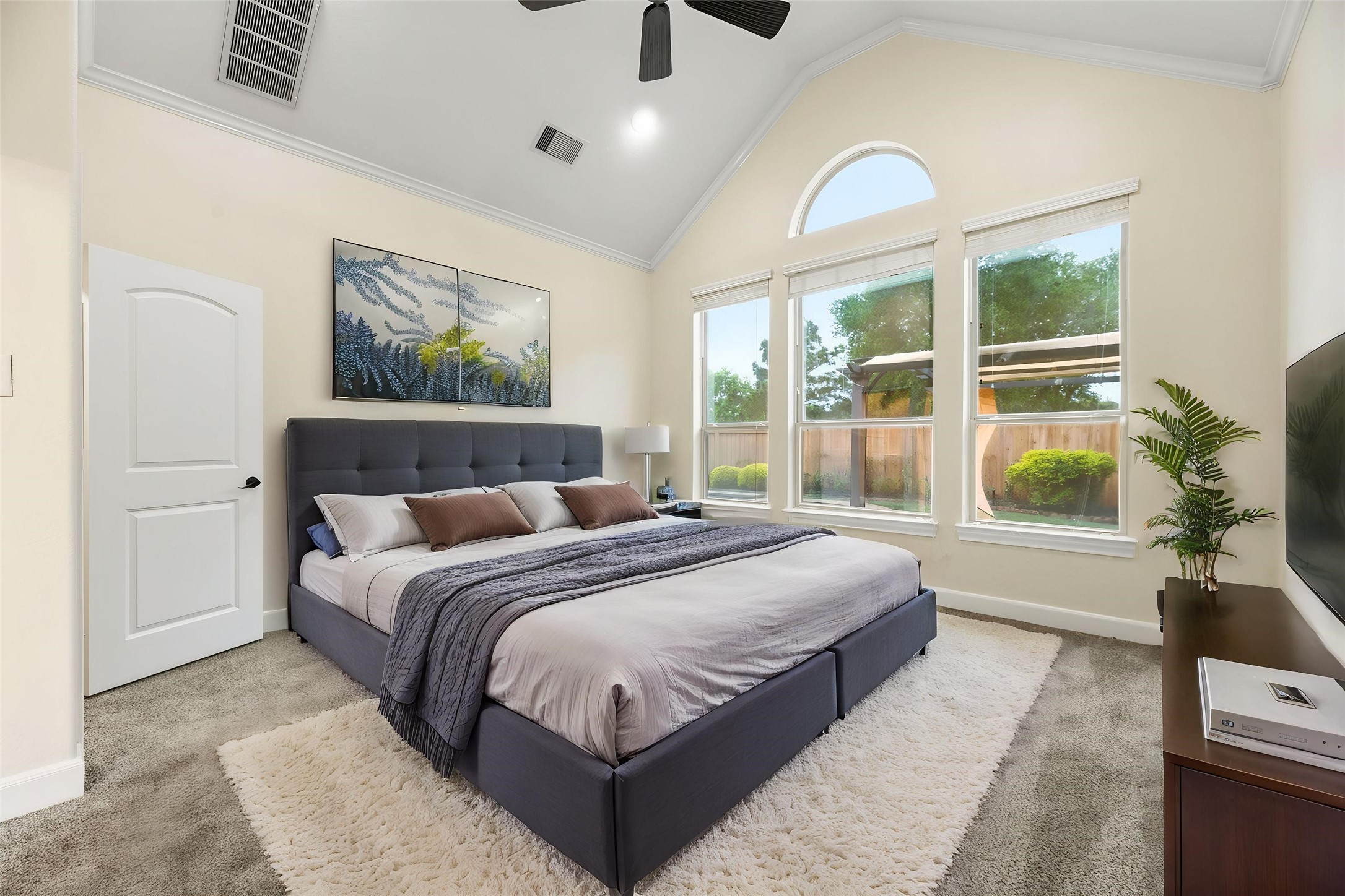 9915 Rochs Hill Court Katy, TX 77494 - Photo 13 of 32 a bedroom with bed and large windows