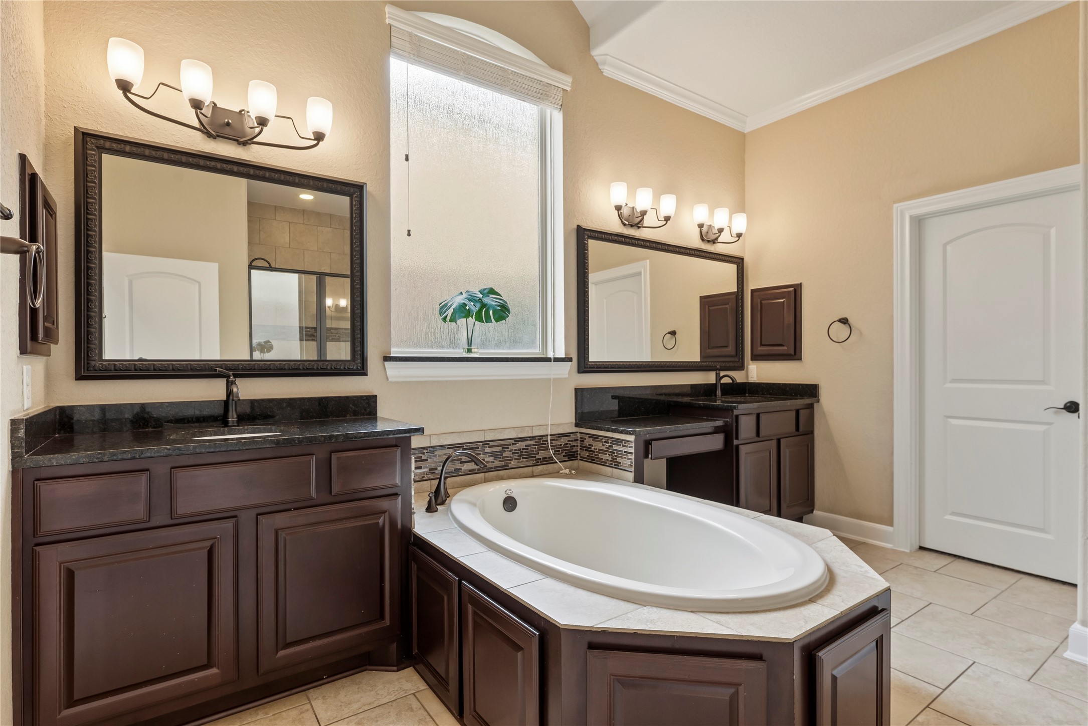 9915 Rochs Hill Court Katy, TX 77494 - Photo 14 of 32 a bathroom with a sink and a mirror
