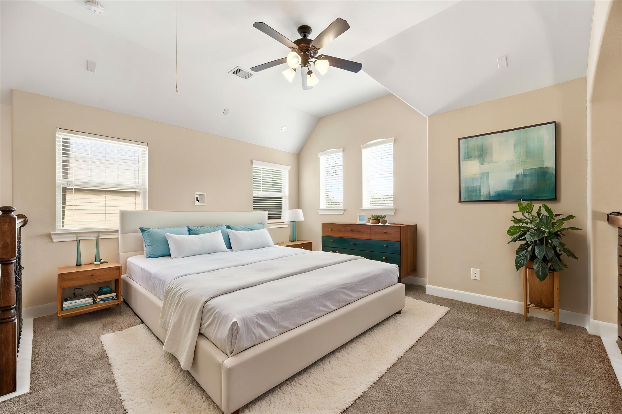 9915 Rochs Hill Court Katy, TX 77494 - Photo 17 of 32 a bedroom with a large bed and a chandelier