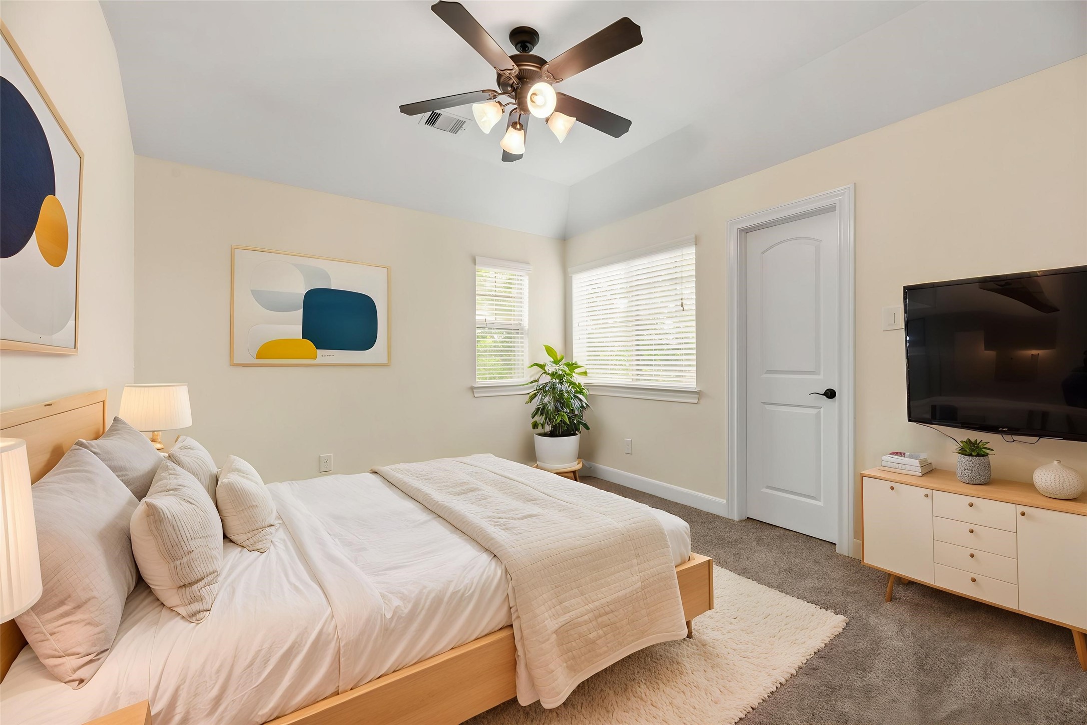 9915 Rochs Hill Court Katy, TX 77494 - Photo 19 of 32 a bedroom with a bed and a flat screen tv