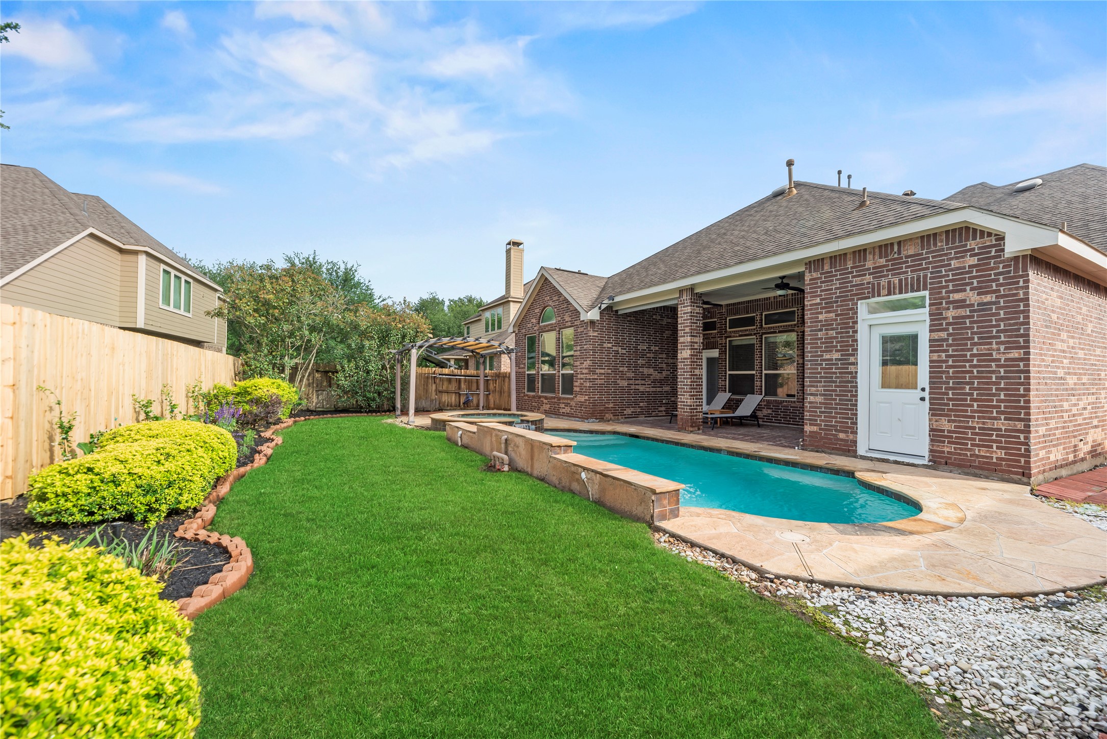 9915 Rochs Hill Court Katy, TX 77494 - Photo 26 of 32 a front view of a house with a yard and porch