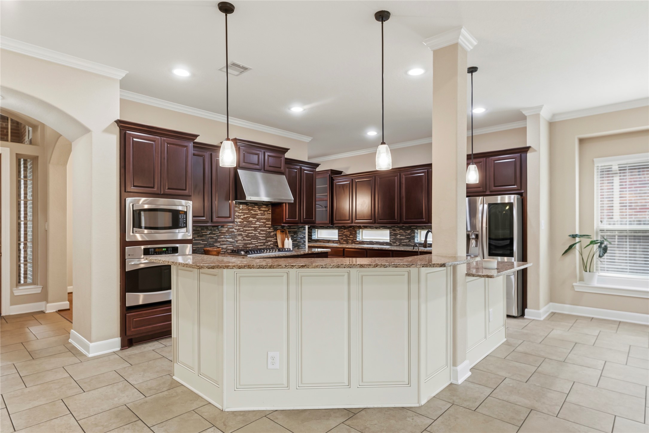 9915 Rochs Hill Court Katy, TX 77494 - Photo 9 of 32 a kitchen with stainless steel appliances granite countertop a refrigerator and a sink