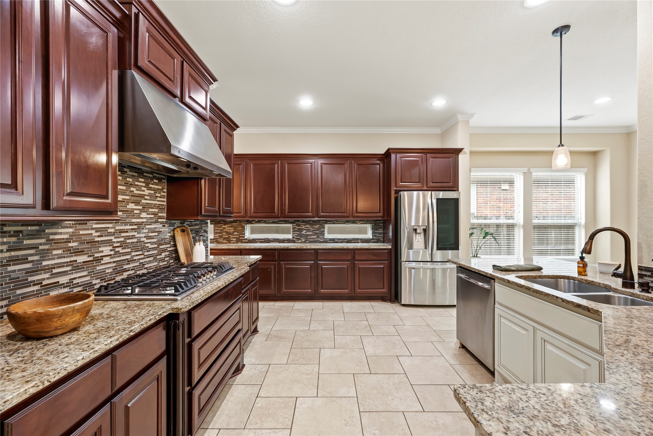 9915 Rochs Hill Court Katy, TX 77494 - Photo 10 of 32 a kitchen with stainless steel appliances granite countertop a sink stove and refrigerator