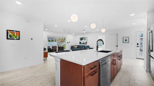 a living room with furniture and a chair