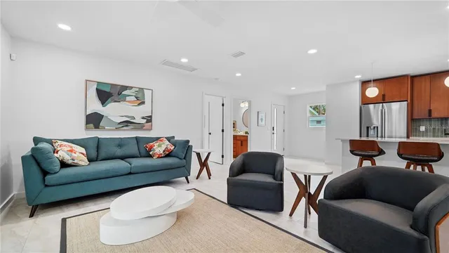 a door with a chair and potted plant