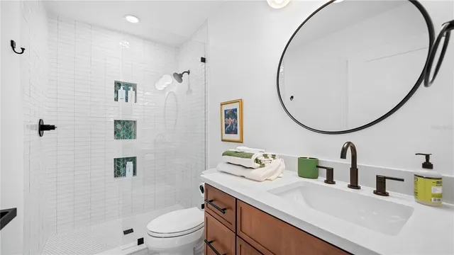 a view of a swimming pool with a patio and a yard