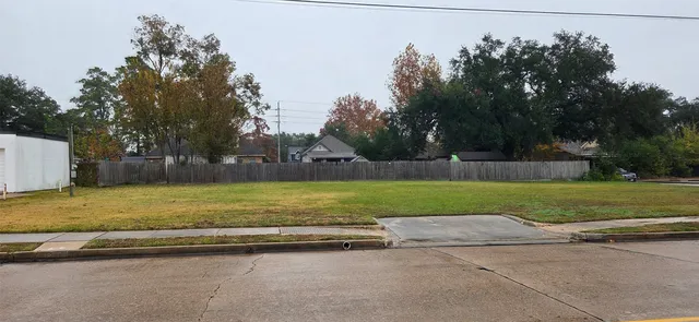 a view of outdoor space with playground and green space