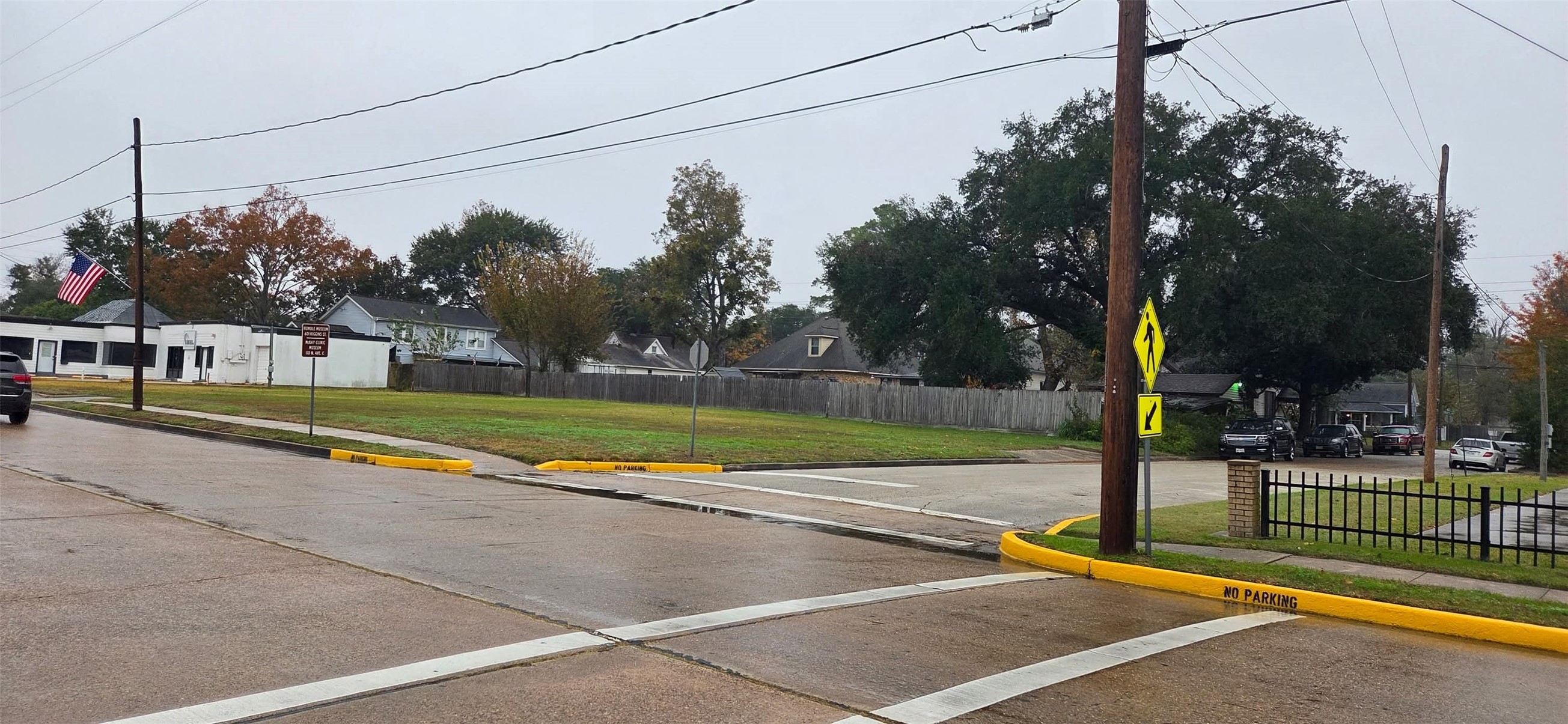 711 East Main Street Humble, TX 77338 - Photo 4 of 5 a view of a tennis ground with a large trees in the background