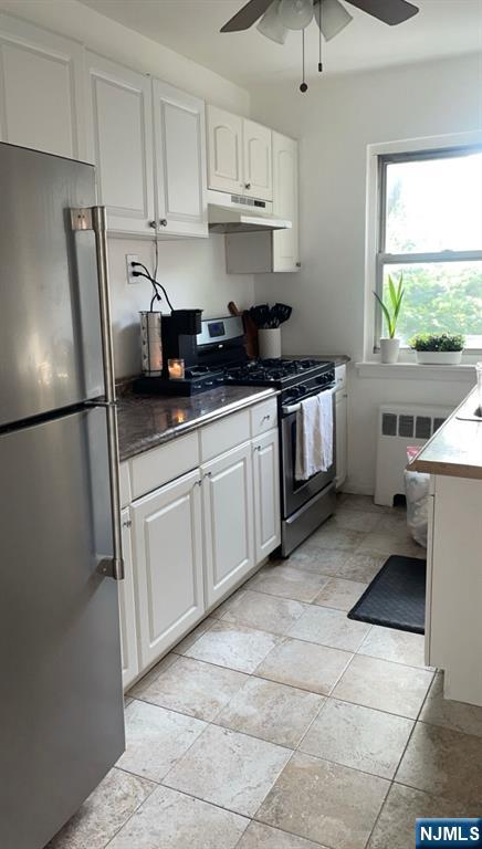 1480 Terrace, Unit 4 Teaneck, NJ 07666 - Photo 10 of 14 a kitchen with stainless steel appliances granite countertop a refrigerator sink and white cabinets