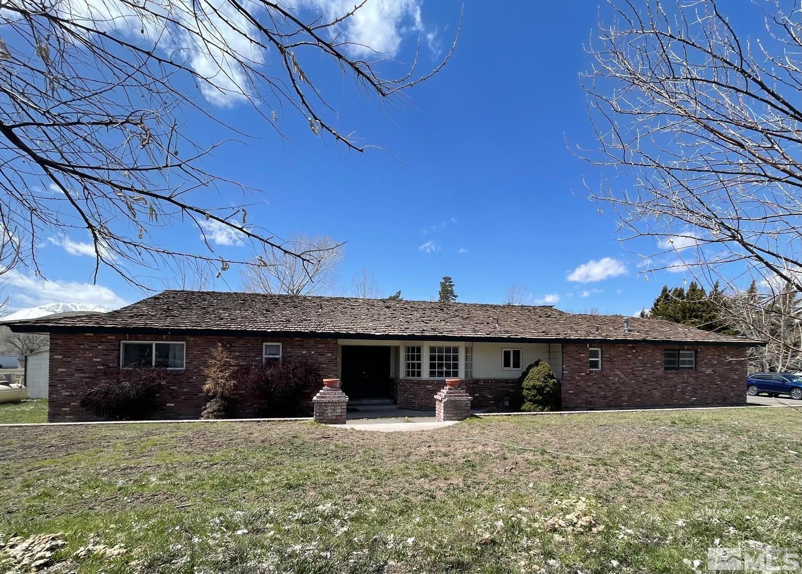 155 Cedar Lane Reno, NV 89521 - Photo 1 of 30 a front view of a house with a yard