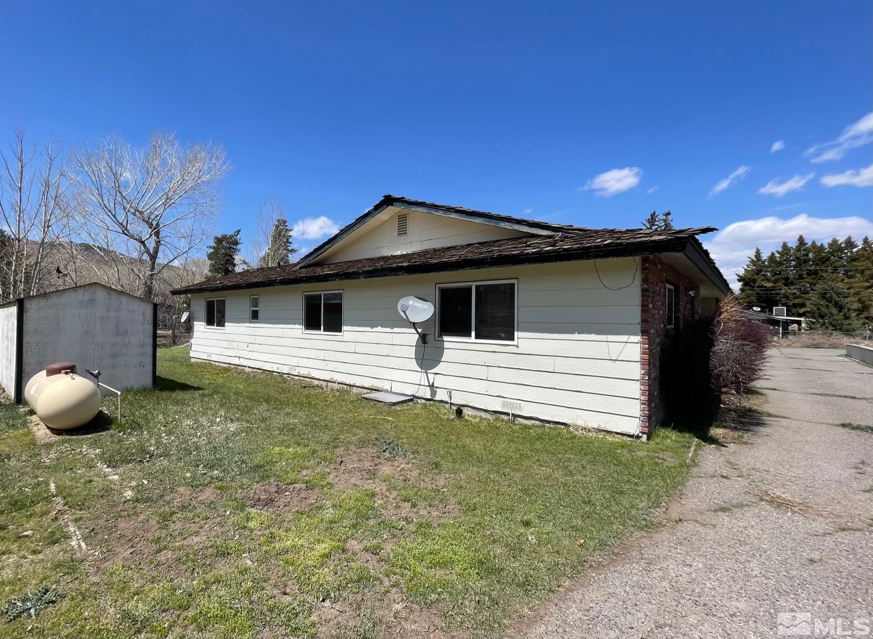 155 Cedar Lane Reno, NV 89521 - Photo 2 of 30 a house with trees in the background