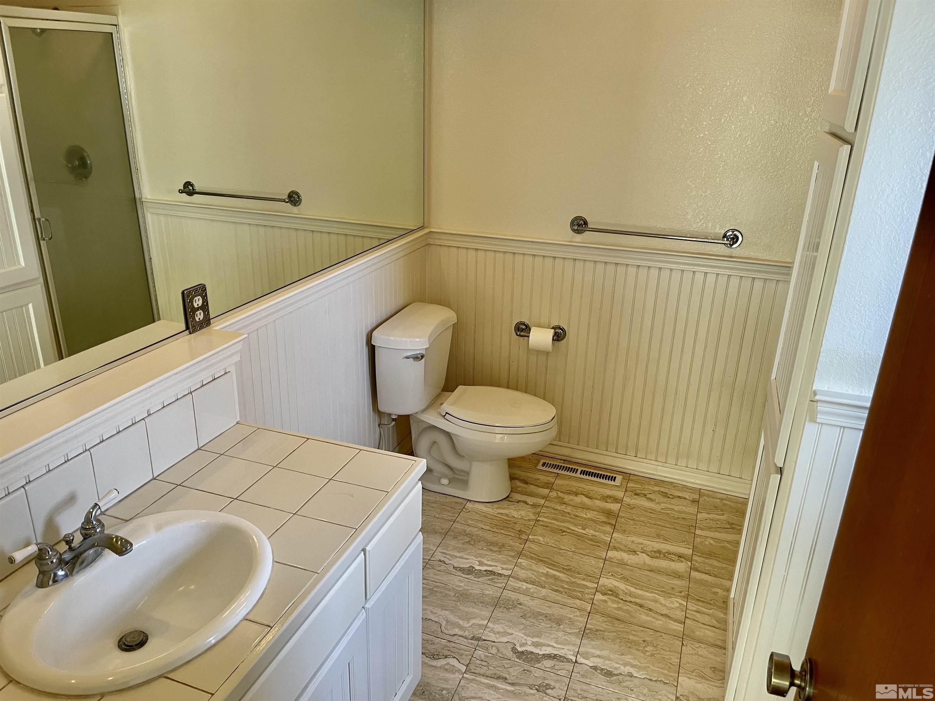 155 Cedar Lane Reno, NV 89521 - Photo 21 of 30 a bathroom with a sink and a mirror