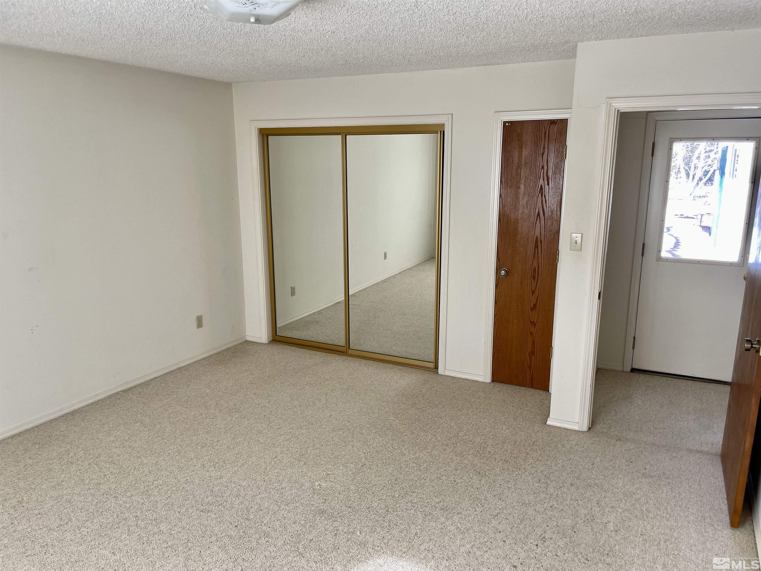 155 Cedar Lane Reno, NV 89521 - Photo 26 of 30 an empty room with windows and closet